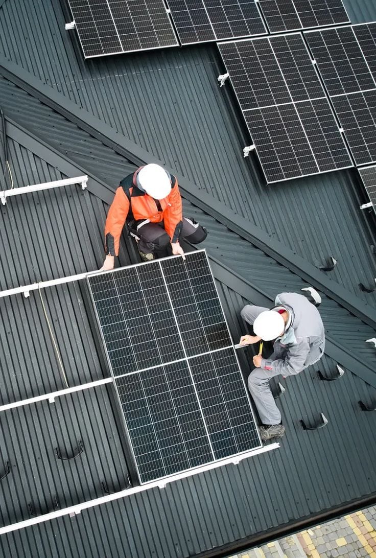 Technician assessing a solar installation in Kenya
